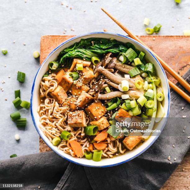 bowl of vegan miso ramen with tofu and mushrooms - ramen noodles stock pictures, royalty-free photos & images
