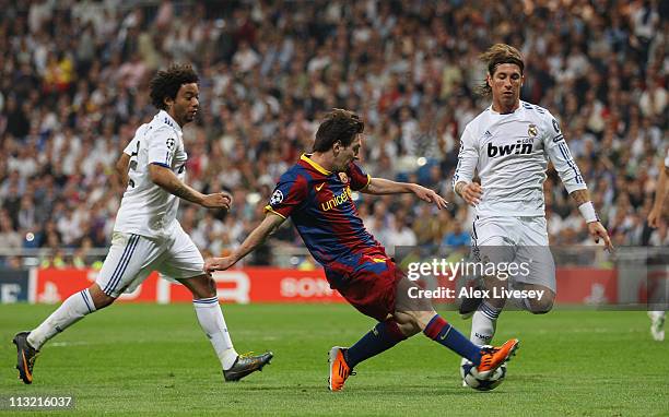 Lionel Messi of Barcelona scores his second goal during the UEFA Champions League Semi Final first leg match between Real Madrid and Barcelona at...