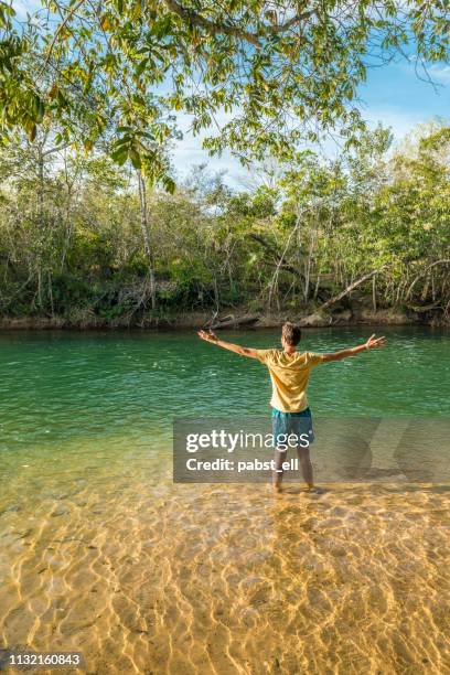 man on shallow formoso river in bonito - bonito stock pictures, royalty-free photos & images