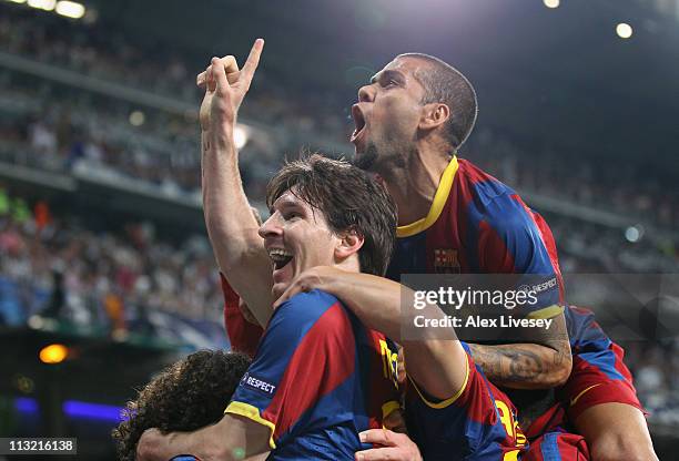 Lionel Messi of Barcelona celebrates with Dani Alves after scoring his second goal during the UEFA Champions League Semi Final first leg match...