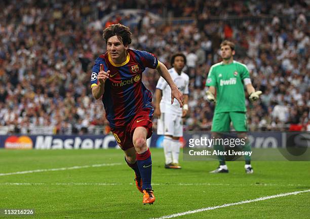 Lionel Messi of Barcelona celebrates after scoring his second goal during the UEFA Champions League Semi Final first leg match between Real Madrid...