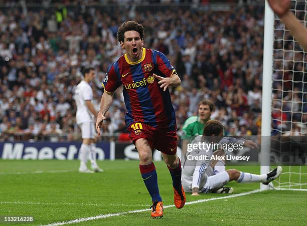 Lionel Messi of Barcelona celebrates after scoring his first goal during the UEFA Champions League Semi Final first leg match between Real Madrid and...