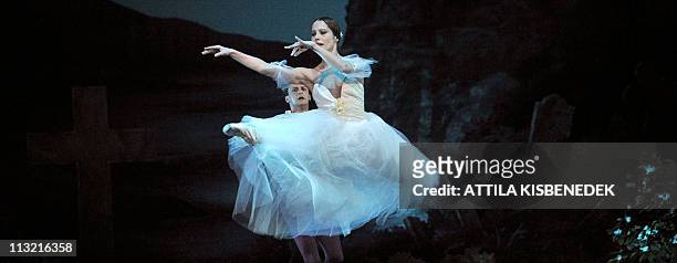 Dancers of Hungarian National Ballet, Alesia Popova and Jozsef Cserta , perform on the stage of the State Opera House in Budapest on April 27, 2011...