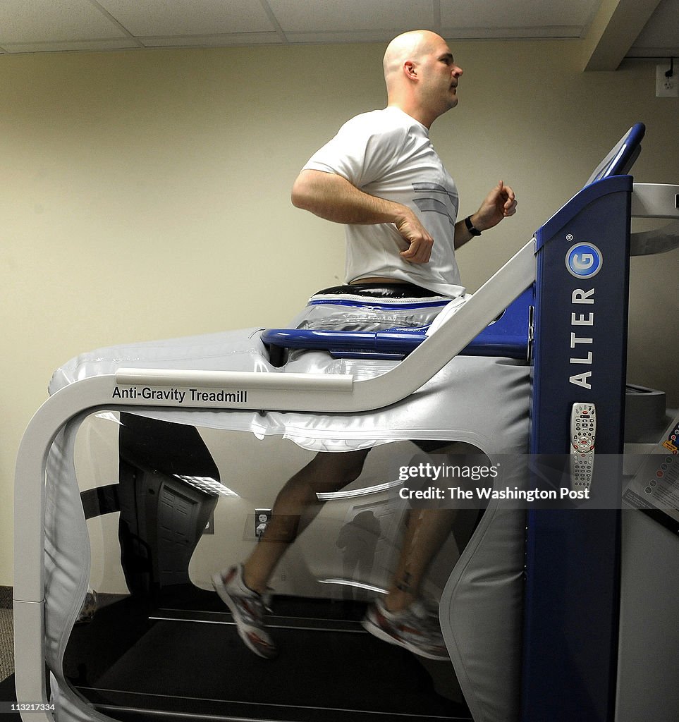 Joe Kehoe, 35 years old of Haymarket, Va. uses the anti-gravity treadmill, which uses air pressure to take the weight off a runner's feet and legs in Gainesville, Va.
