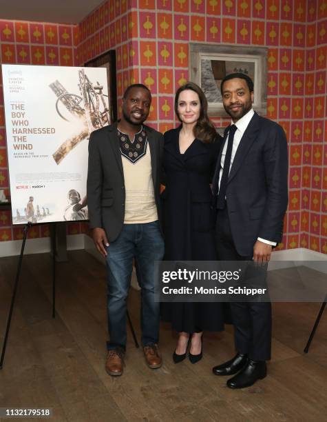 Book author William Kamkwamba, host Angelina Jolie and director Chiwetel Ejiofor attend "The Boy Who Harnessed The Wind" Special Screening at Crosby...