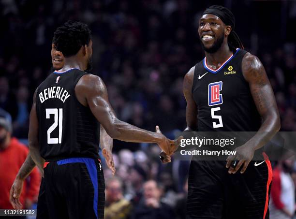 Montrezl Harrell of the LA Clippers celebrates his dunk with Patrick Beverley after a Dallas Mavericks timeout during the first half at Staples...