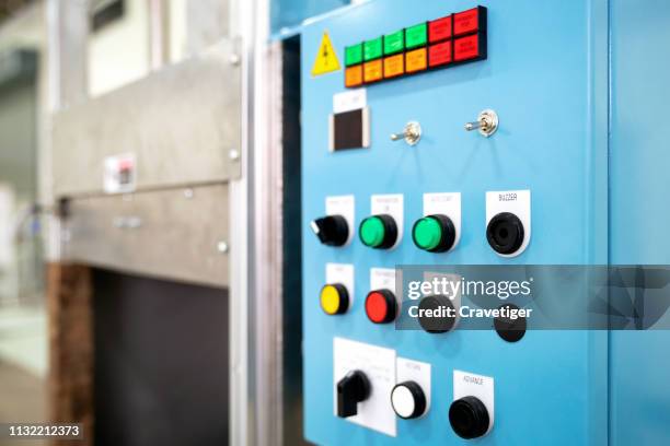 control panel of an automatic machine in the manufacturing factory. - electrical panel box fotografías e imágenes de stock