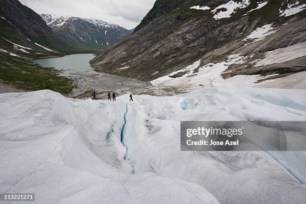hiking on the nigardsbreen glacier, near jostedal, norway. - jostedalsbreen stock pictures, royalty-free photos & images