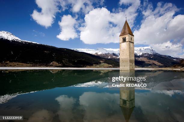 The bell tower in Reschensee. Lago di Resia. Lake Reschen. South Tyrol. Italy. Europe.