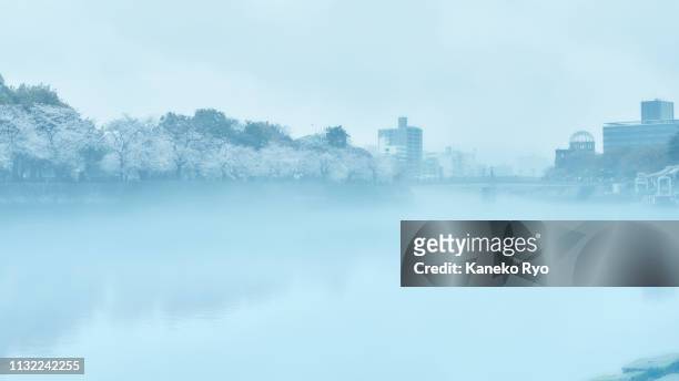 atomic bomb dome in fog - hiroshima bombing stock pictures, royalty-free photos & images
