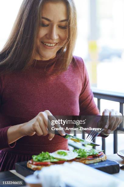 woman eating lunch at cafe - almaty stock pictures, royalty-free photos & images