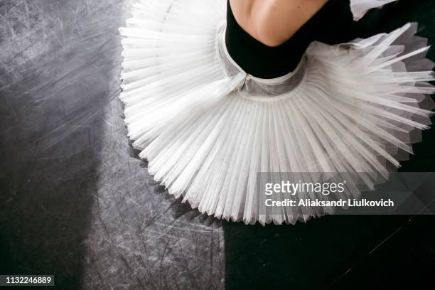 skirt of ballerina sitting - tutu stock pictures, royalty-free photos & images