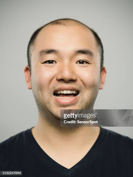 portrait of real young adult chinese man with excited expression - fat bald men stock pictures, royalty-free photos & images