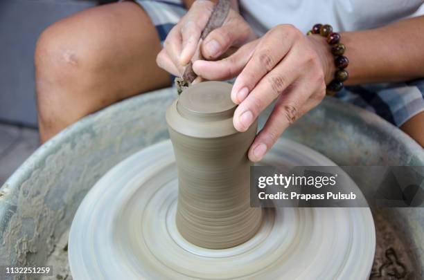 hands working on pottery wheel - clay pot making stock pictures, royalty-free photos & images