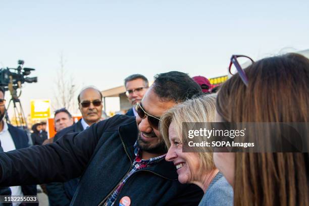 Alberta Premier, Rachel Notley seen taking a selfie with a supporter at the Campaign office of Jasvir Deol during the Alberta Provincial Election...