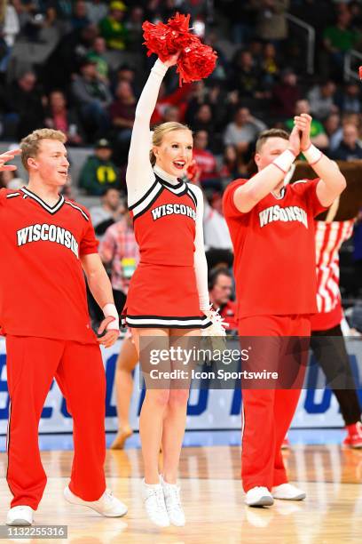 Wisconsin cheerleader performs during the game between the Wisconsin Badgers and the Oregon Ducks in their NCAA Division I Men's Basketball...