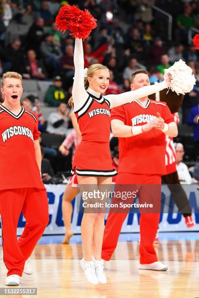 Wisconsin cheerleader performs during the game between the Wisconsin Badgers and the Oregon Ducks in their NCAA Division I Men's Basketball...