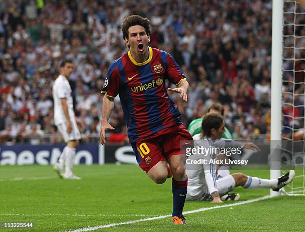 Lionel Messi of Barcelona celebrates after scoring his first goal during the UEFA Champions League Semi Final first leg match between Real Madrid and...