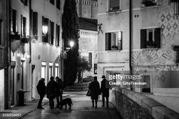 treviso -romantic walk in the historic center on a winter evening - treviso italy stock pictures, royalty-free photos & images