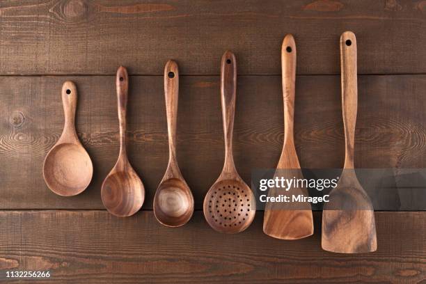 wooden kitchen utensils on wood table - kitchenware shop stock pictures, royalty-free photos & images