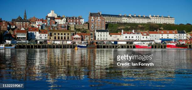 The sun shines down on Whitby Harbour in North Yorkshire on February 26, 2019 in Whitby, England. Warm weather continues to sweep the country as the...