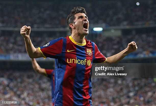 David Villa of Barcelona celebrates after Lionel Messi scores the opening goal during the UEFA Champions League Semi Final first leg match between...