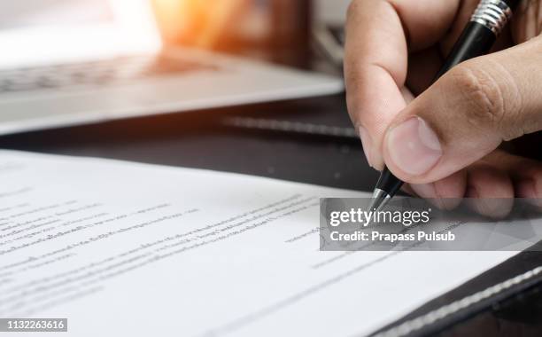 man signing contract. close up. deal concept - deal signing stockfoto's en -beelden