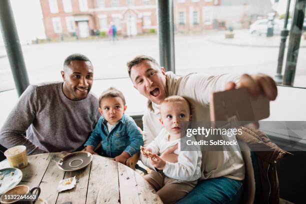 friends taking a selfie in a cafe with their babies - play date stock pictures, royalty-free photos & images