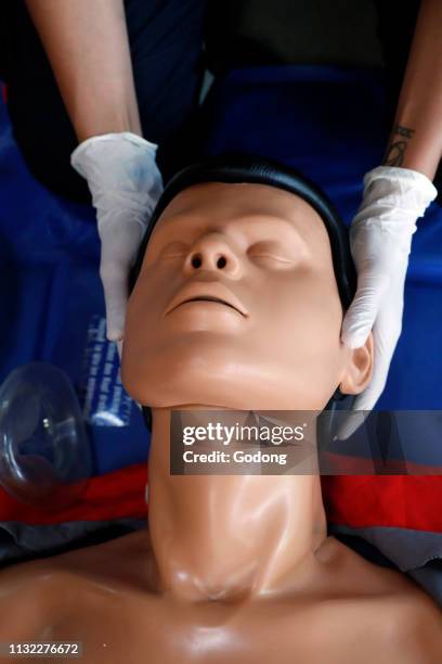 Life-saving first aid on a model. Training session exercise. France.
