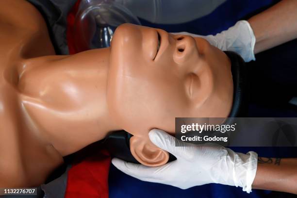 Life-saving first aid on a model. Training session exercise. France.