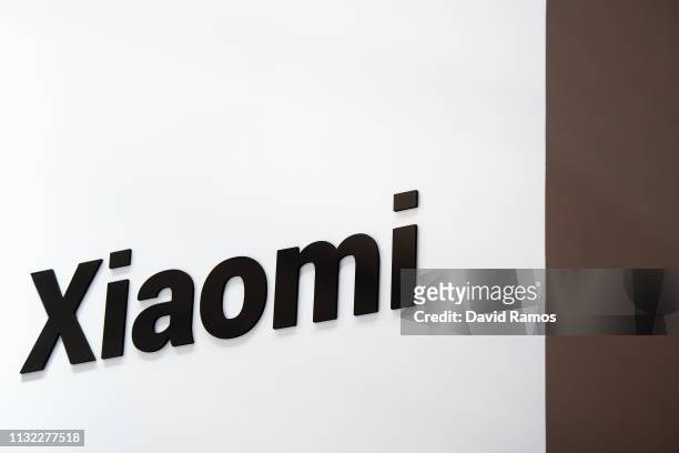 Logo sits illumintated outside the Xiaomi booth on day 2 of the GSMA Mobile World Congress 2019 on February 26, 2019 in Barcelona, Spain. The annual...
