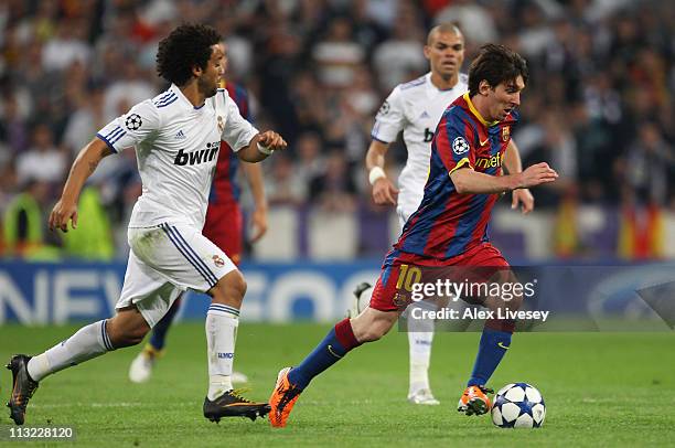 Lionel Messi of Barcelona beats Marcelo of Real Madrid during the UEFA Champions League Semi Final first leg match between Real Madrid and Barcelona...