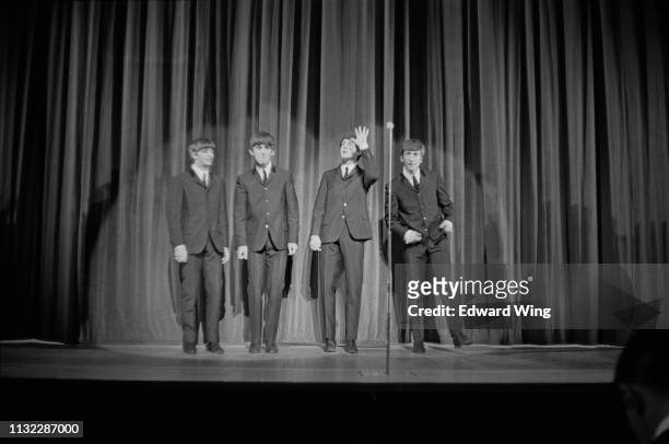 British rock band The Beatles on stage at the London Palladium, UK, 13th October 1963; Ringo Starr, George Harrison , Paul McCartney, John Lennon .