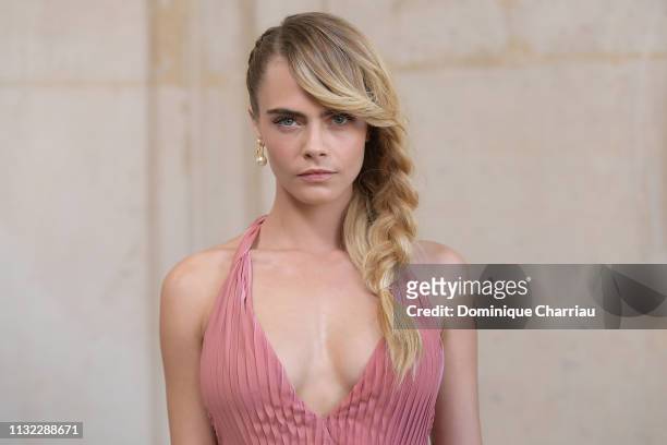 Model Cara Delevingne attends the Christian Dior show as part of the Paris Fashion Week Womenswear Fall/Winter 2019/2020 on February 26, 2019 in...