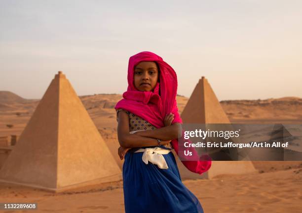 Portrait of sudanese girl visiting the pyramids of the kushite rulers at Meroe, Northern State, Meroe, Sudan on December 28, 2018 in Meroe, Sudan.