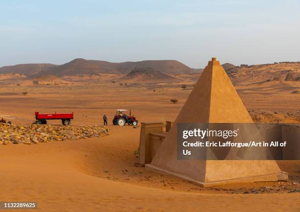 Workers making renovation in the reconstructed pyramids of the kushite rulers at Meroe, Northern State, Meroe, Sudan on December 28, 2018 in Meroe,...