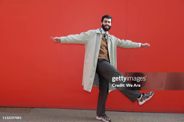 young man in playful pose. - bloco de cor imagens e fotografias de stock