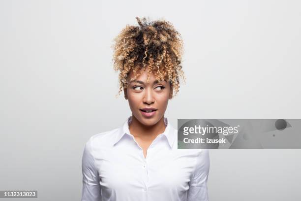 mid adult businesswoman looking sideways - sideways glance stock pictures, royalty-free photos & images