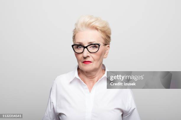 serious businesswoman on white background - bossy woman stock pictures, royalty-free photos & images