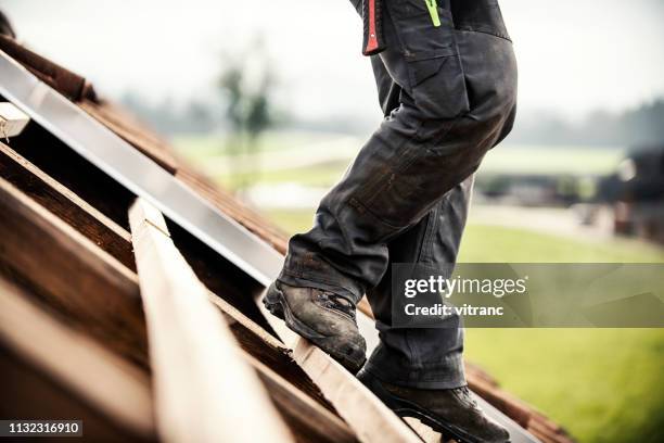 roofer at work - rooftop stock pictures, royalty-free photos & images