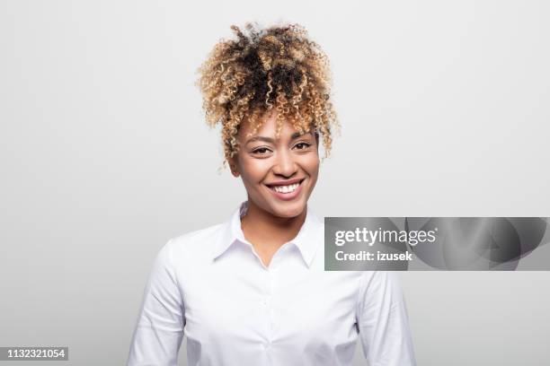 portrait of smiling female business professional - curly hair woman white shirt stock pictures, royalty-free photos & images