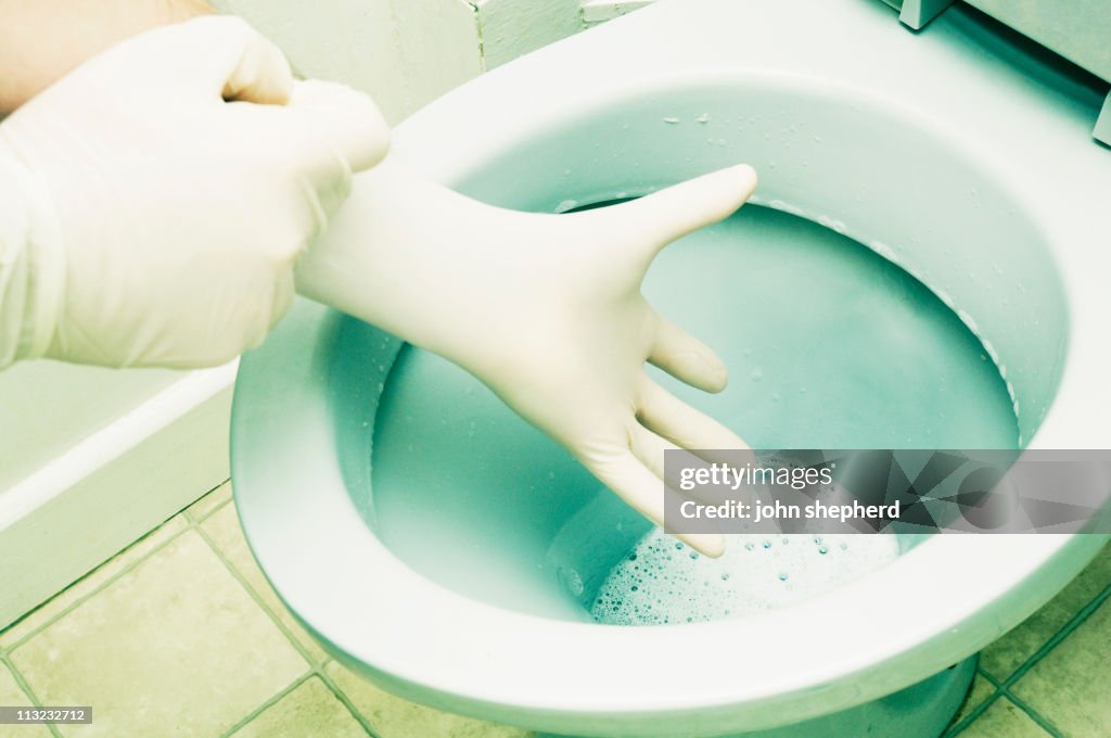 House cleaning, toilet bowl rubber gloves