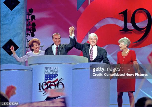 Former US Senator Bob Dole and former US Secretary of Housing and Urban Development Jack Kemp on the podium with their wives after accepting the 1996...