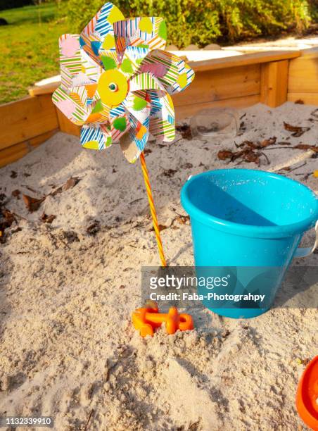 toys in sandpit - plastikmaterial stock pictures, royalty-free photos & images