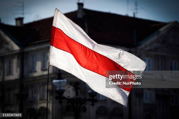 Several dozen people gathered in the center of Warsaw, Poland on March 23, 2019 to celebrate the founding of the first independent Belarusian...