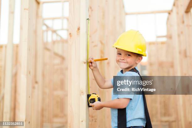 young boy construction worker - boy in hard hat stock pictures, royalty-free photos & images