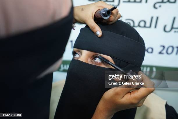 November 25 2018. Yemeni women practice make-up at a Saudi Foundation women's community center on November 25, 2018 in Aden, Yemen.