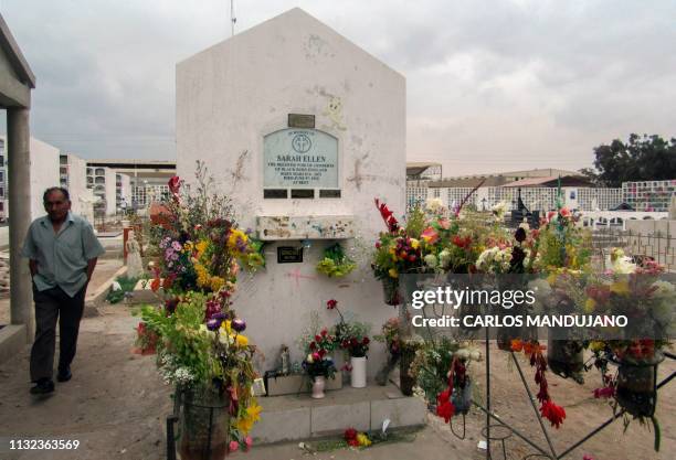 Man walks by the tomb of Briton Sarah Ellen , considered one of the lovers of Count Dracula and executed in her hometown of Blackburn, England, in...