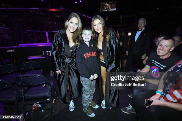 Luca Cesternino poses for a photo with UFC Octagon girls Brittney Palmer and Arianny Celeste during the UFC Fight Night event at Bridgestone Arena on...