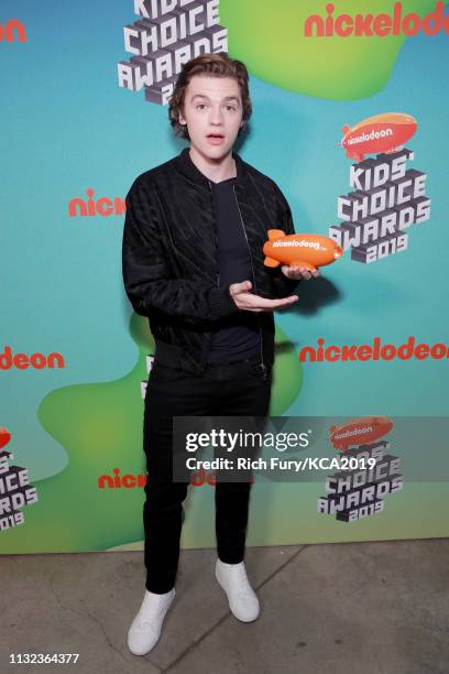 Joel Courtney poses with award at Nickelodeon's 2019 Kids' Choice Awards at Galen Center on March 23, 2019 in Los Angeles, California.